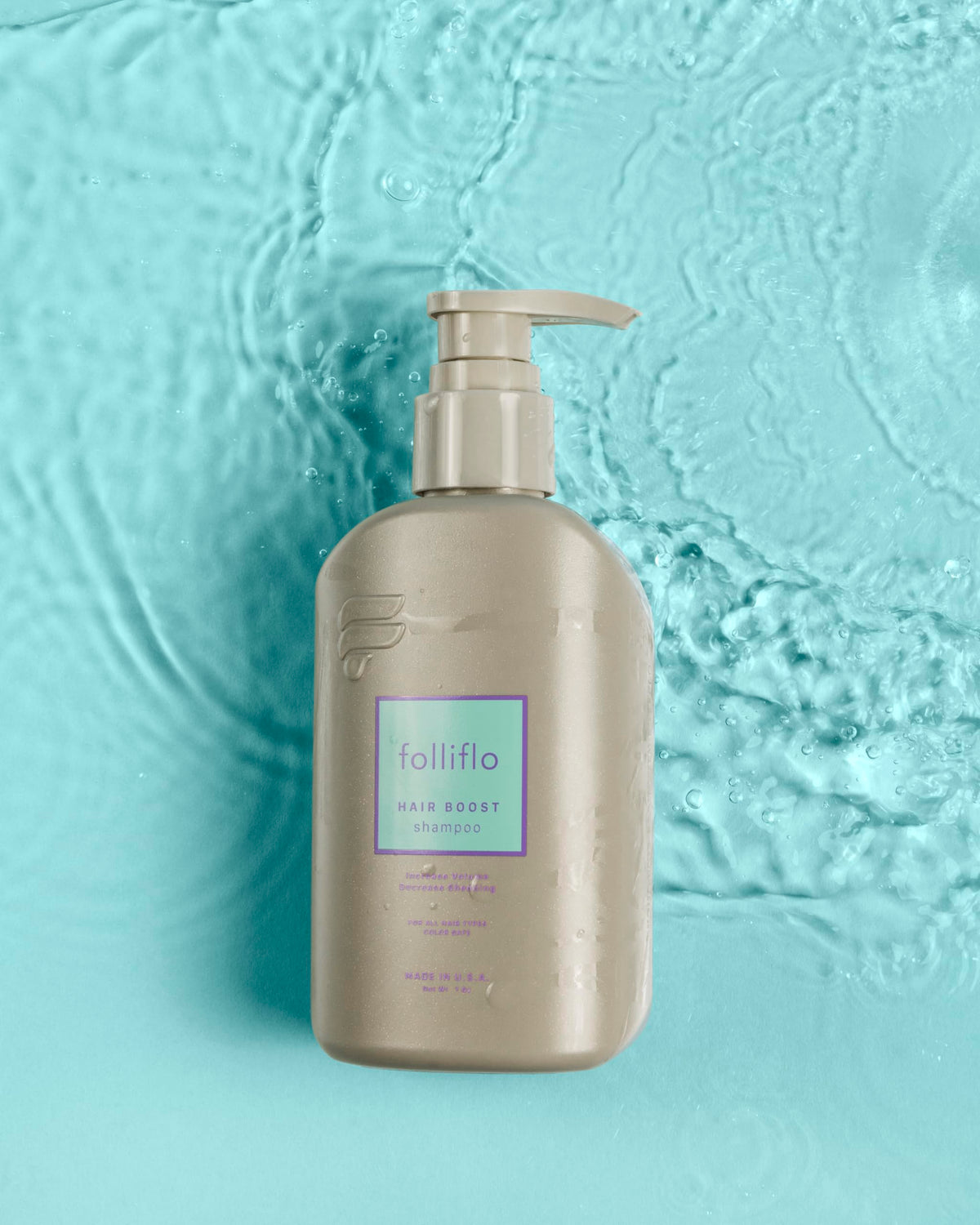 Folliflo Hair Boost Shampoo bottle with easy-grip design for everyday use.