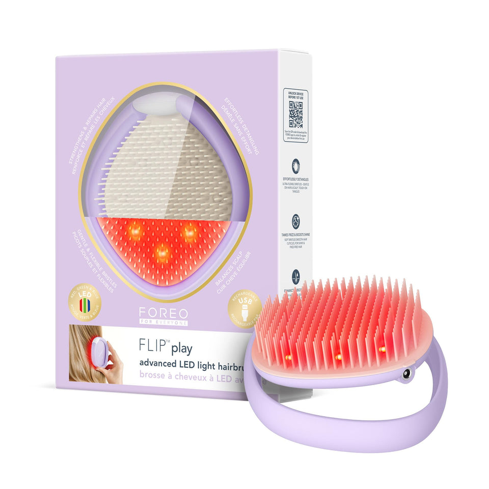 FOREO Flip Play brush front view showing compact travel-ready design for detangling