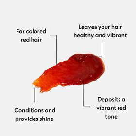 Close-up of Color Mask Red depositing red pigment on hair strands.