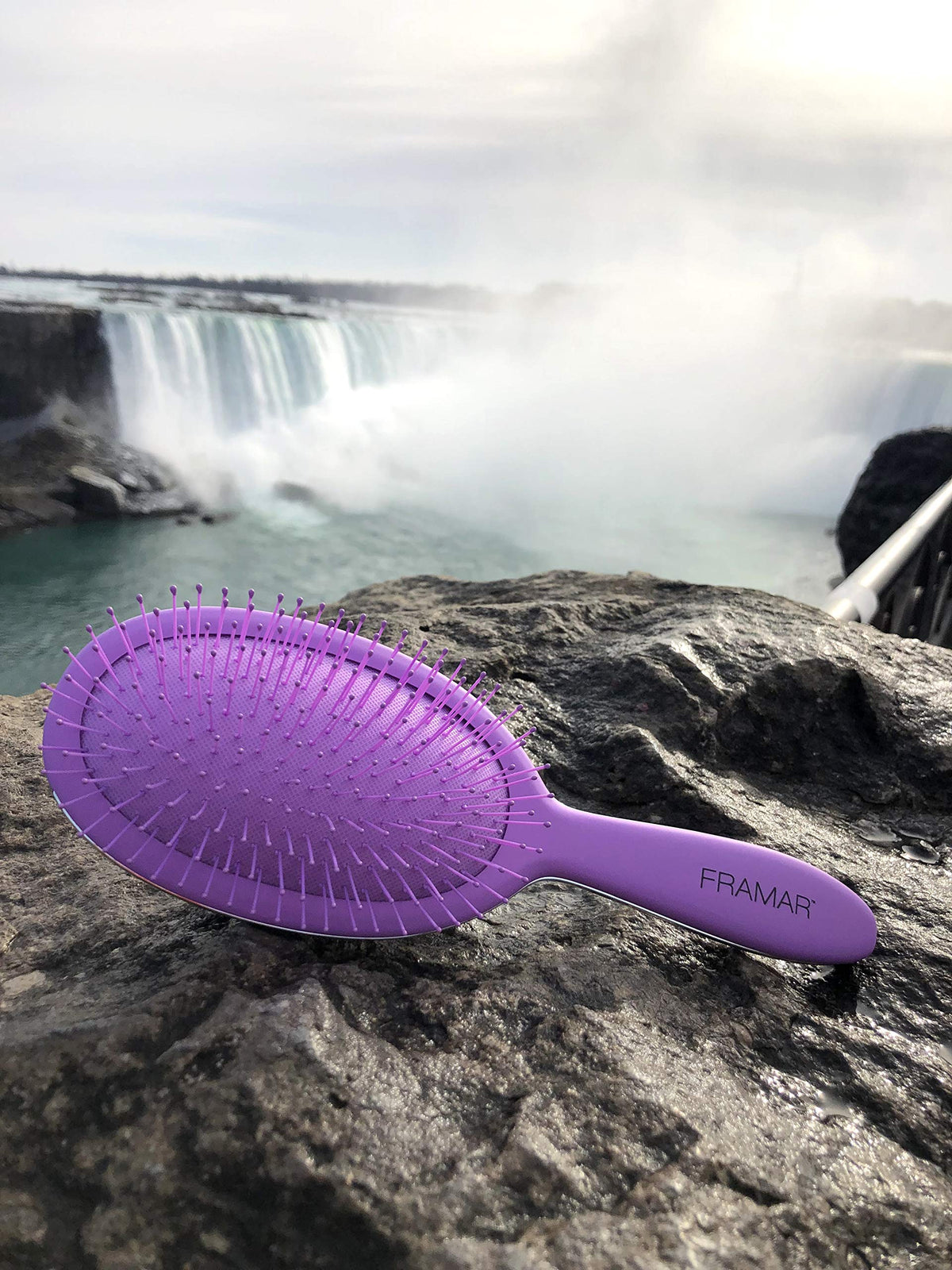 FRAMAR detangling brush available in four colors with Silver Lining