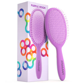 FRAMAR detangling brush in purple gliding through curly hair for gentle detangling