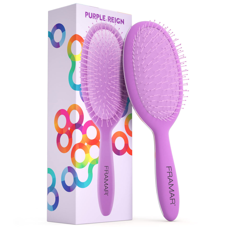 FRAMAR detangling brush in purple gliding through curly hair for gentle detangling