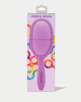 Ergonomic grip handle on FRAMAR detangling brush for secure brushing