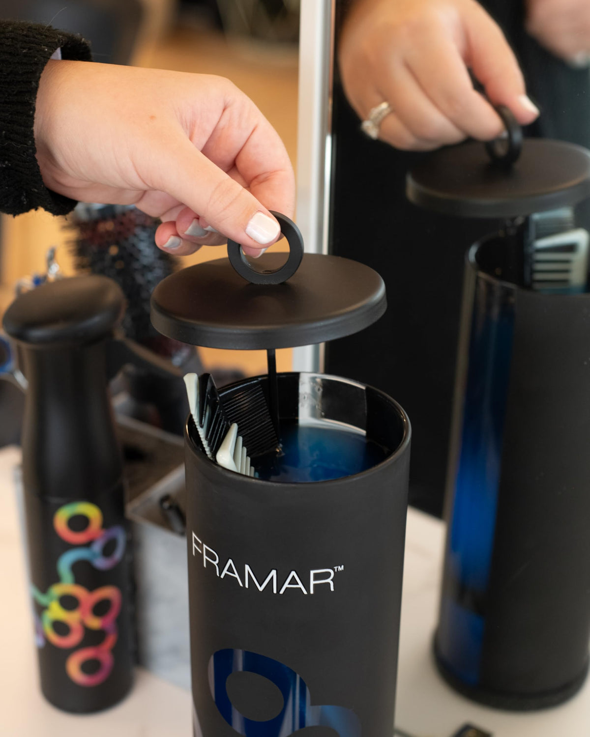 FRAMAR disinfectant jar with non-slip base for stable sanitizing sessions.