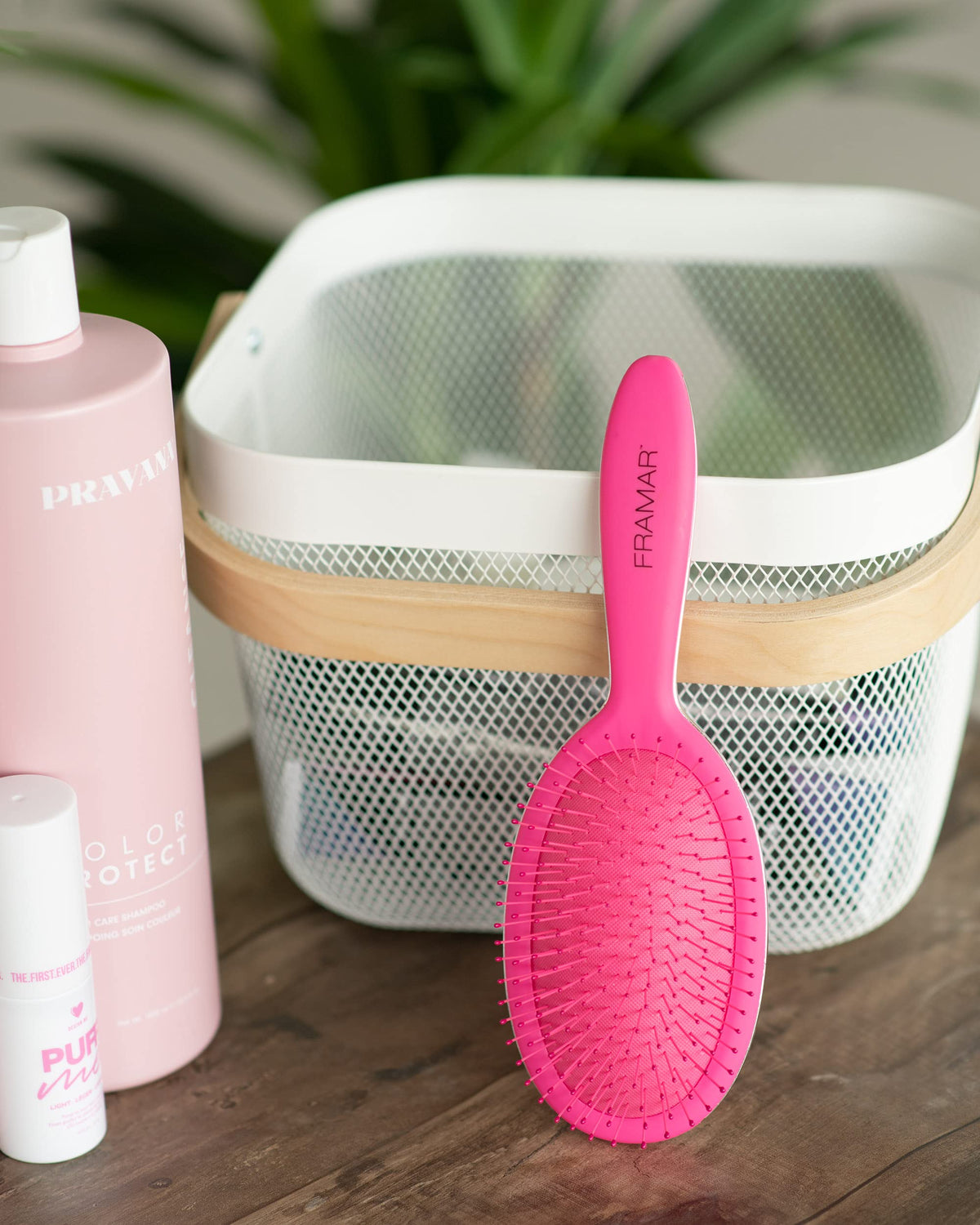 FRAMAR pink detangling brush design adds style to daily hair care.