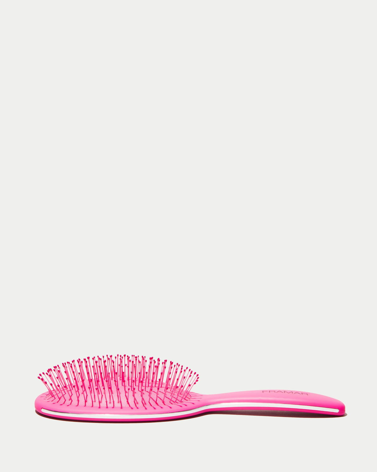 FRAMAR pink handle hairbrush smoothly glides through hair for quick styling.