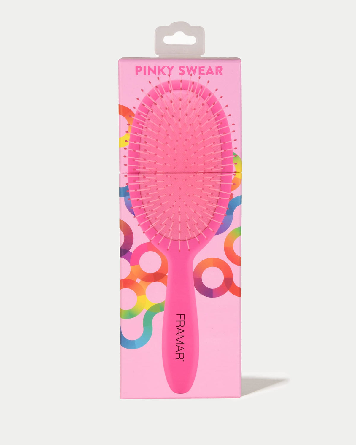 FRAMAR soft-bristle detangler assists gentle knot removal without ripping hair.