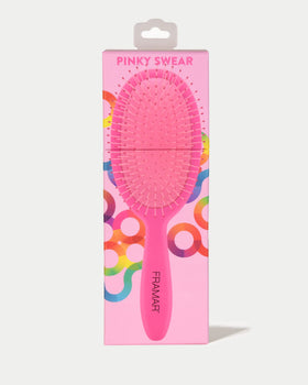 FRAMAR soft-bristle detangler assists gentle knot removal without ripping hair.