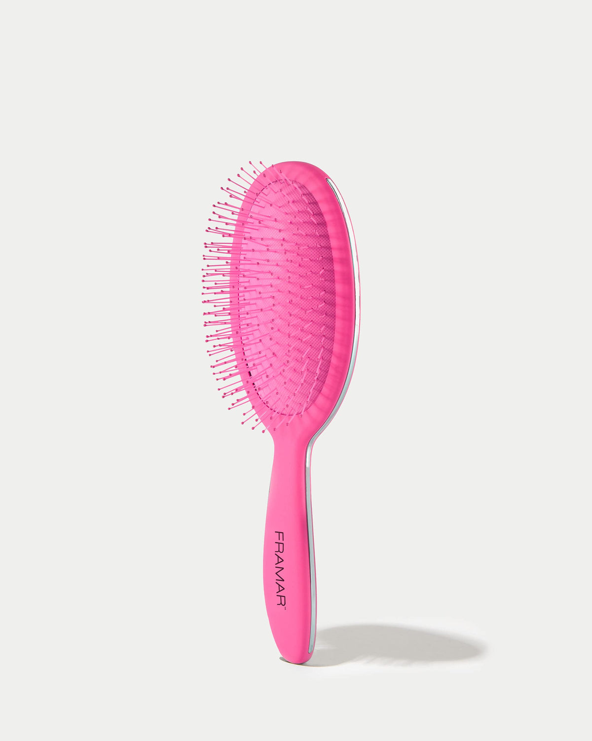 FRAMAR wet hair brush in pink designed for pain-free brushing on wet hair.