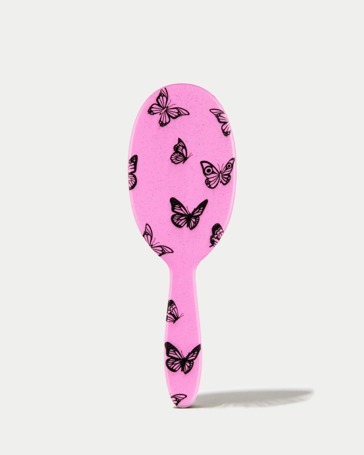 FRAMAR Y2K print detangler brush featuring a comfortable, non-slip handle