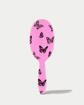 FRAMAR Y2K print detangler brush featuring a comfortable, non-slip handle