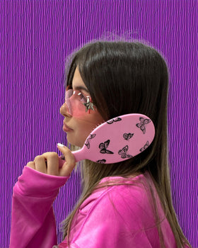 FRAMAR Y2K print detangler brush with cow-print design for stylish routine