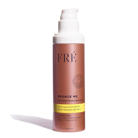 FRÉ Bronze Me SPF 50 bottle cap showing tinted sunscreen and glow