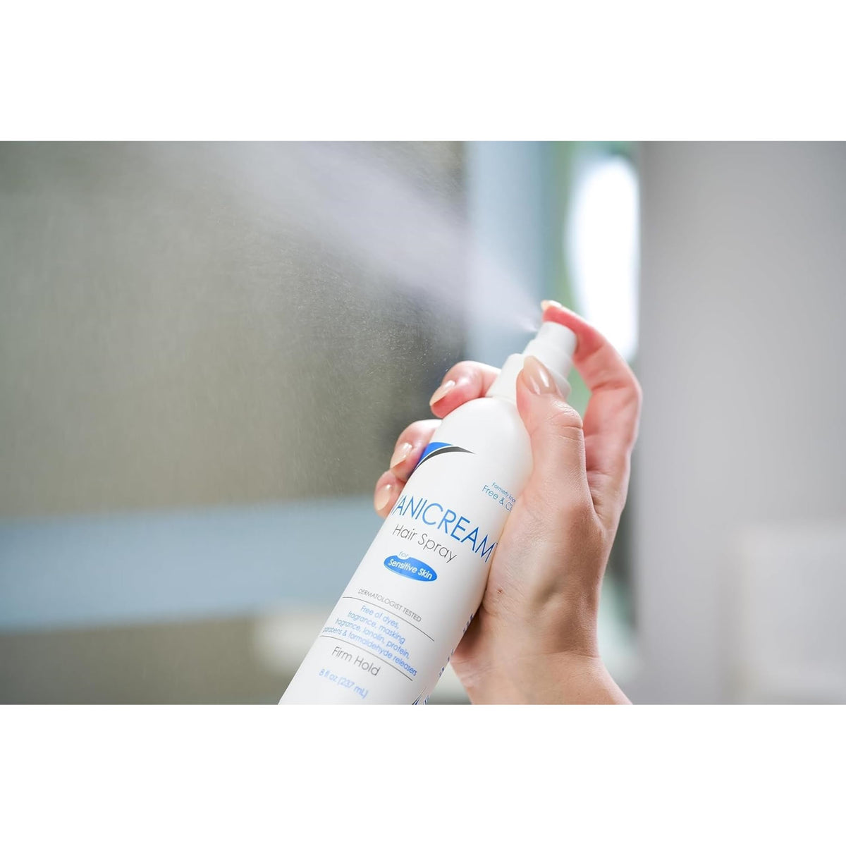Travel-friendly Free & Clear Hairspray packaging fits in a gym bag.