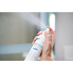 Travel-friendly Free & Clear Hairspray packaging fits in a gym bag.