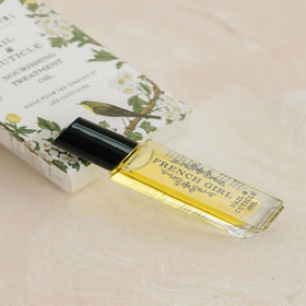 Applying French Girl Organics Nail & Cuticle Oil for daily moisture.
