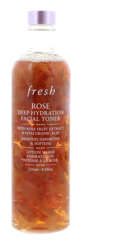 Fresh Rose Deep Hydration Toner application shows hands applying with a cotton pad for refined pores