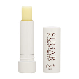 Close-up of Fresh Sugar Advanced Therapy Lip Treatment half-size compact showing glossy nourishment.