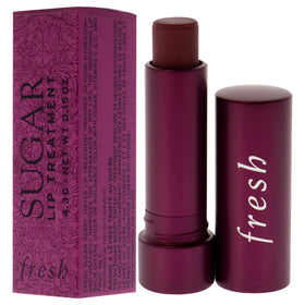 Fresh Sugar Lip Treatment Berry tube close-up shows nourishing lip care in use