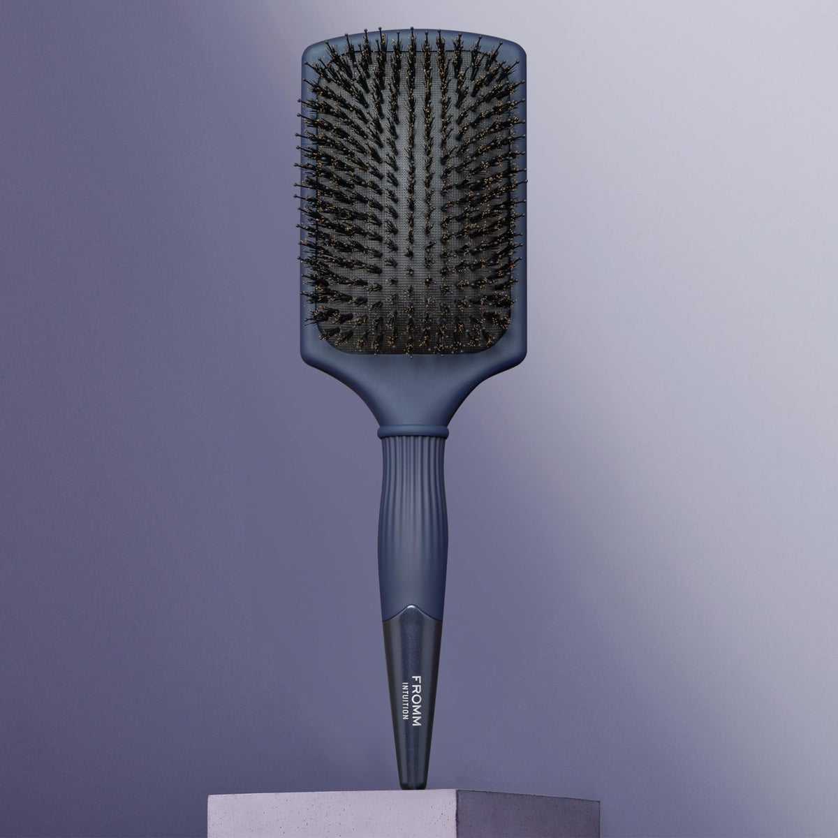 Fromm Intuition Glosser detangles dry hair for a sleek, finished look.