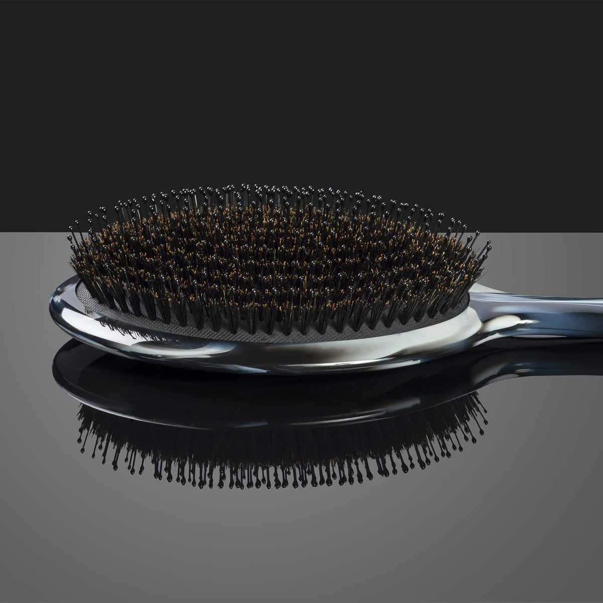 Fromm Elite Polisher ceramic-infused pins massage scalp while smoothing frizz.