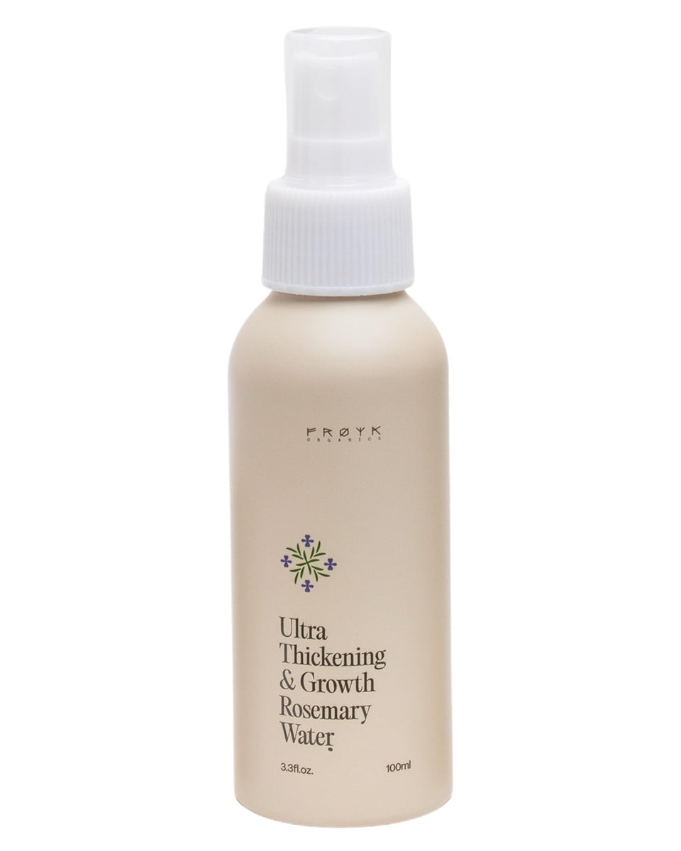 FRØYA Ultra Thickening Rosemary Water Spray refreshing damp hair for scalp hydration.