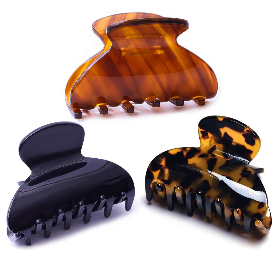 FSMiling tortoise claw clip closeup highlights secure grip for everyday styling.