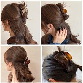 FSMiling tortoise claw clip worn in hair demonstrates versatile styling options.
