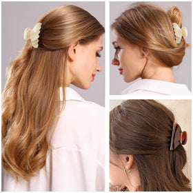 Fsmiling black claw clip in a chic updo with secure hold.
