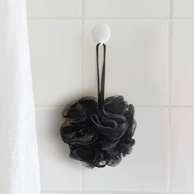 Funnymoom black and white loofah—stylish bathroom decor and exfoliation.