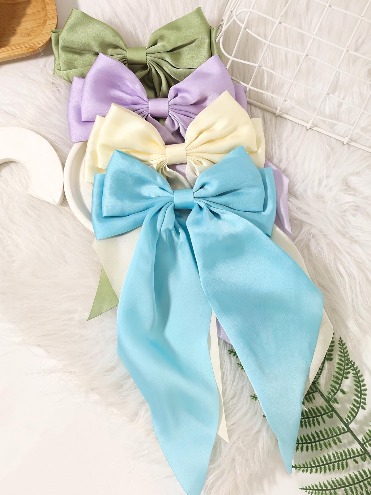 Furling Pompoms retro bow adds elegant flair to any day