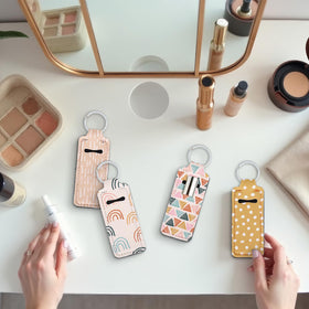 Travel-friendly lipstick holder clips onto purses and backpacks.