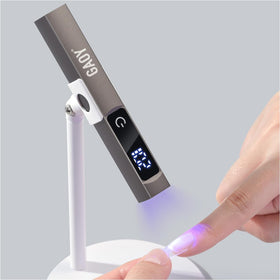 GAOY cordless nail lamp with stand for flexible curing at home or on the go.