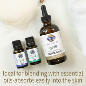 Garden of Life Jojoba Oil pour bottle demonstrating smooth, non-greasy texture in use.