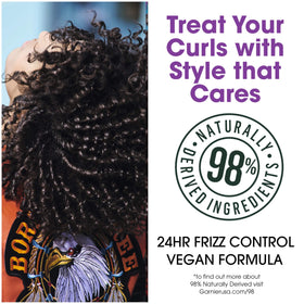 Applying Garnier Fructis Curl Defining Smoothie to damp hair to shape curls