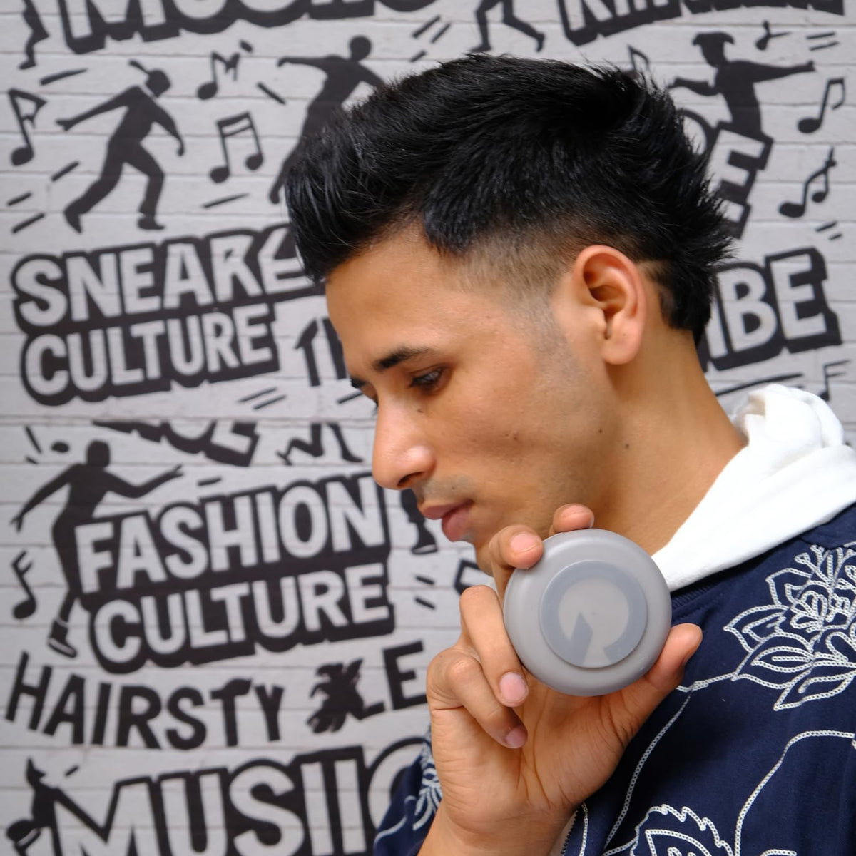 Person applying Gatsby gel to hair, showing easy distribution and control.