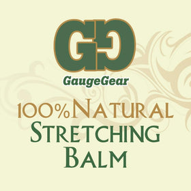Application on stretched ear showing creamy balm texture.