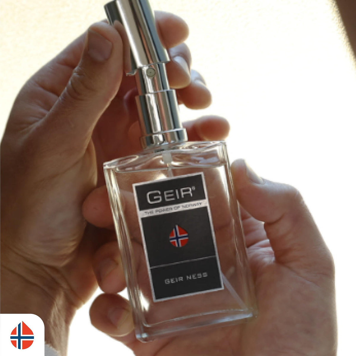 Geir Ness EDP spray action showing a light mist for subtle scent.