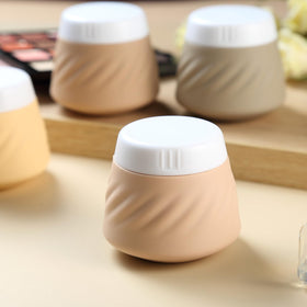 Gemice wide-mouth jars simplify scooping creams and lotions for quick packing.