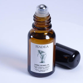 Generic Cyperus Rotundus Oil packaging and travel-size container.