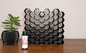 Generic Markvicka hexagon wall mount organizer keeps Shades EQ bottles within easy reach.