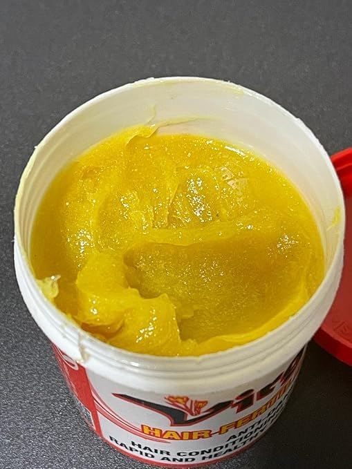 Generic Virgin Hair Fertilizer cream texture close-up for smoothing.