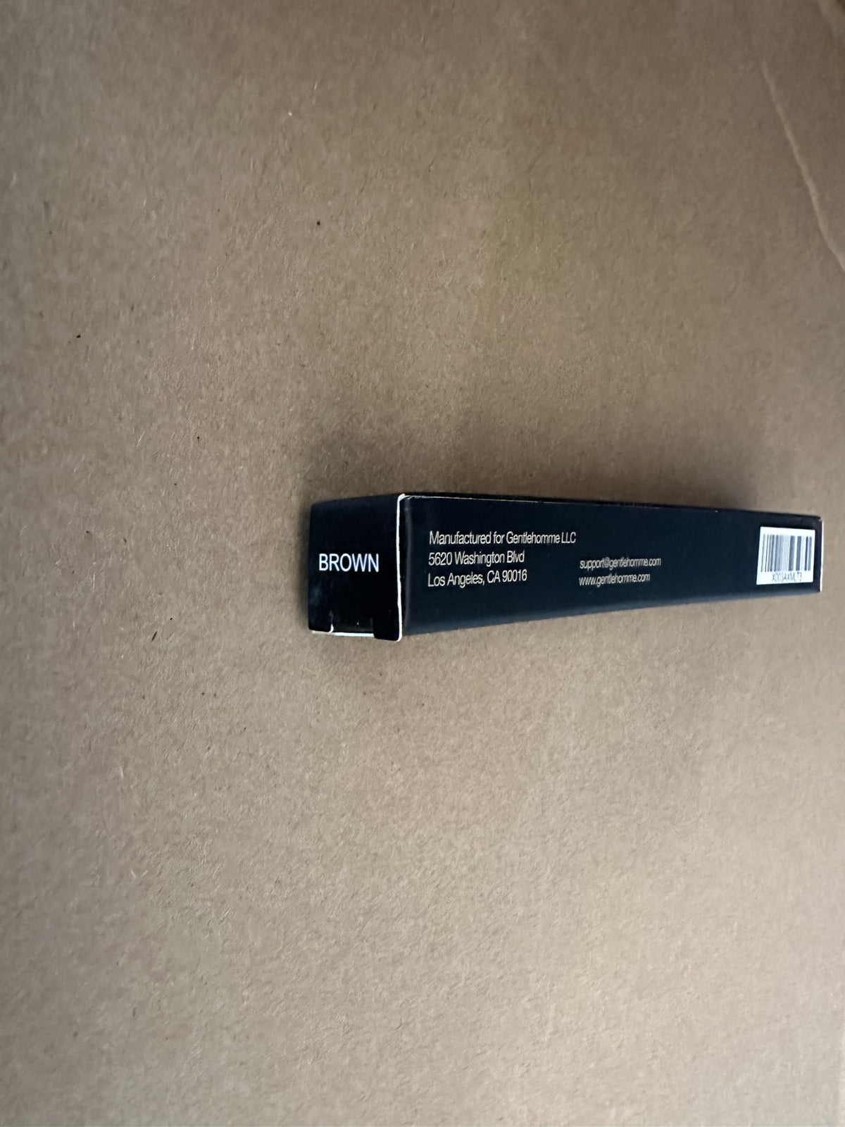 Gentlehomme Brow Pencil in use for quick grooming on the go.