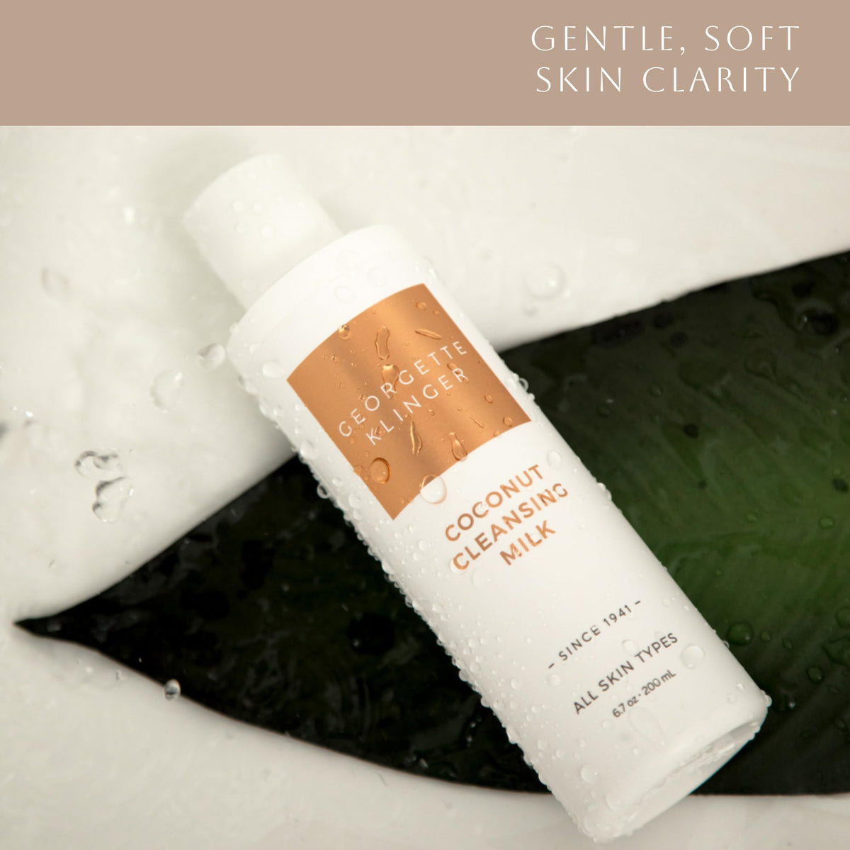 Creamy cleansing milk texture close-up highlighting coconut oil