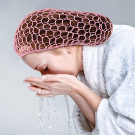 Geyoga blue hairnet snood on bun showing breathable, comfortable fit.