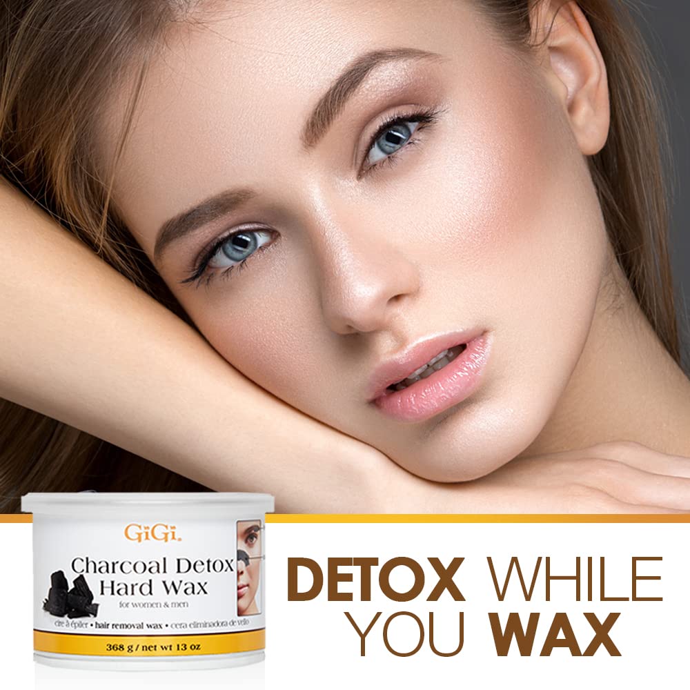 GIGI Charcoal Detox Facial Wax spread on face for gentle smoothing.