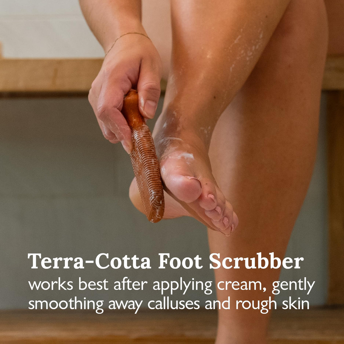 Gilden Tree terra-cotta pumice stone next to feet