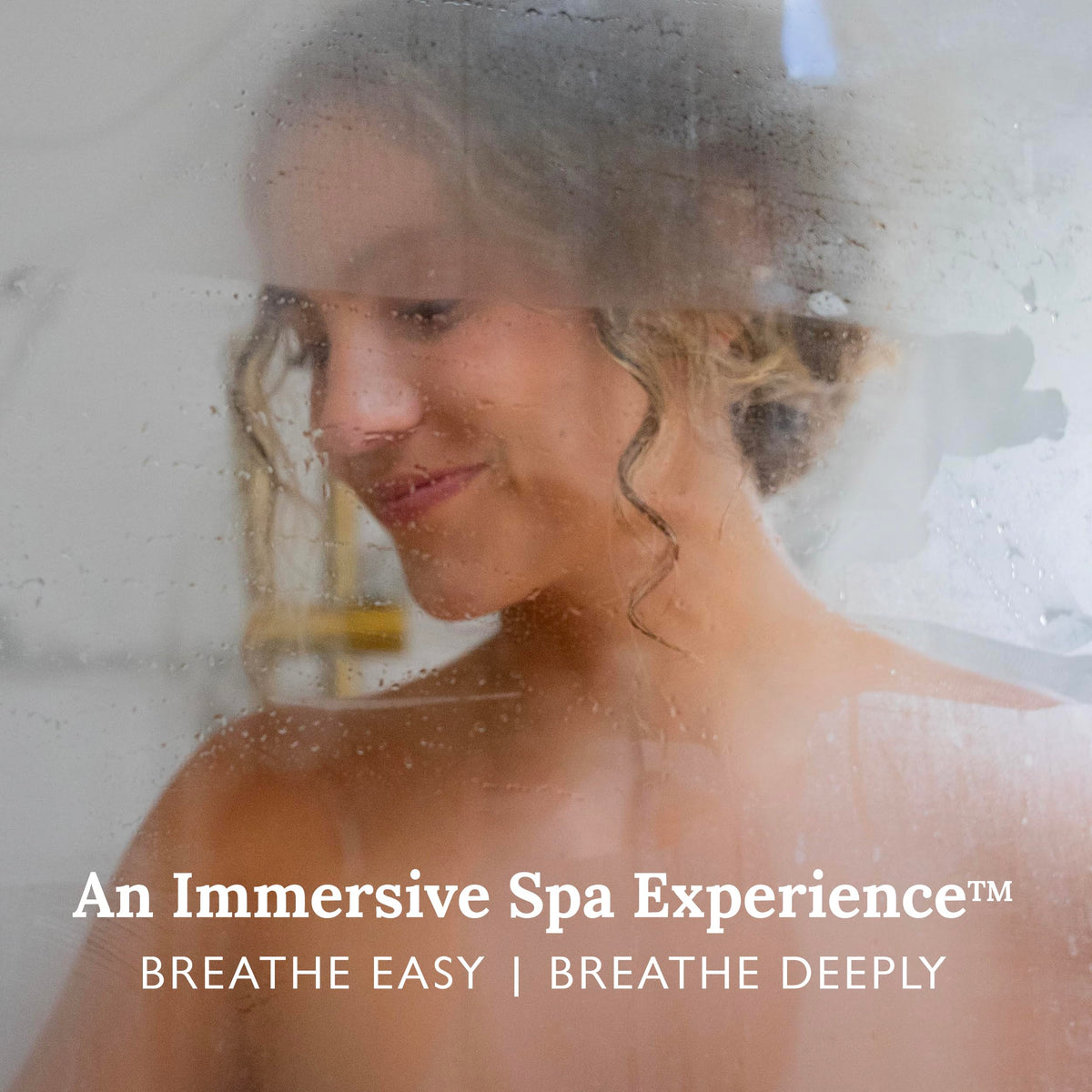 Gilden Tree shower steamer tablet resting on the shower floor as it begins to release scent.