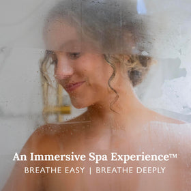 Gilden Tree shower steamer tablet resting on the shower floor as it begins to release scent.