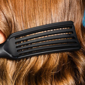 GIMME Beauty Vented Detangling Brush curved design for comfortable scalp care.